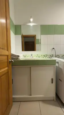 a bathroom with a sink and a mirror at Lavinia Apartment Playa Potrero in Potrero