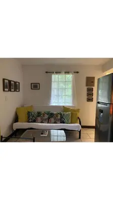 a living room with a couch and a window at Apartamento Manzu in Santa Cruz