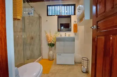 a bathroom with a shower and a sink and a toilet at Cozy Jungle Loft Close to Tamarindo and Surf Beaches in Santa Rosa