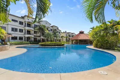 a pool at a resort with palm trees and a gazebo at LPT15 in Villarreal