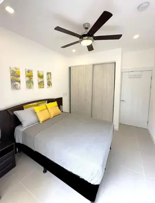 a bedroom with a bed with a ceiling fan at LPT15 in Villarreal