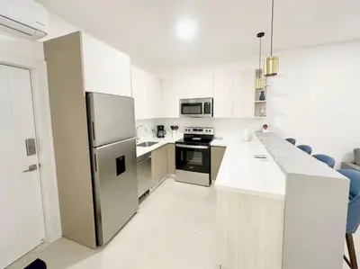 a kitchen with a stainless steel refrigerator and appliances at LPT15 in Villarreal