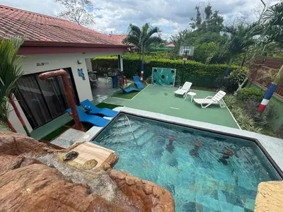 a house with a swimming pool and a backyard at Spring House in Ángeles