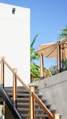 a set of stairs leading up to a building at The Sandhaus Suite 5 in Jacó