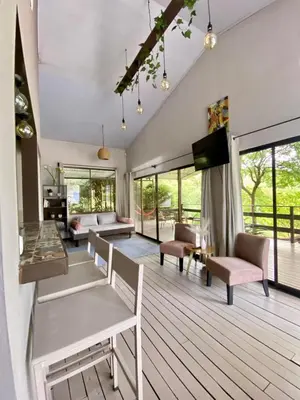 a living room with a table and chairs at Casa Dama Santa María de Dota in Santa María