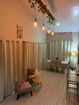 a living room with a table and chairs and lights at Casa Dama Santa María de Dota in Santa María