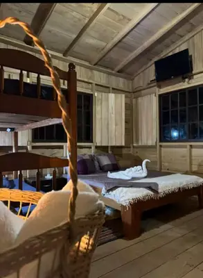a bedroom with two bunk beds and a couch at Cabaña Cóncavas in Marbella