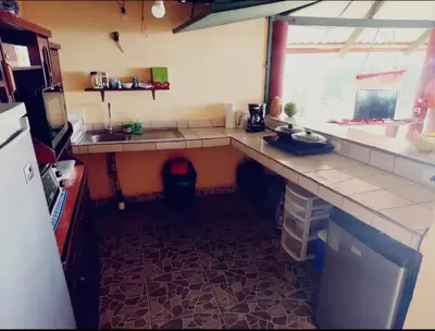 a kitchen with a counter and a sink and a window at Cabaña Cóncavas in Marbella