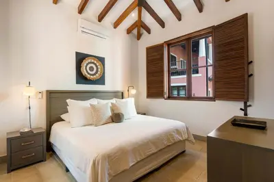 a bedroom with a bed and a window at Bright Modern Home with Beach Club Access and Walking Distance to the Beach in Playa Danta