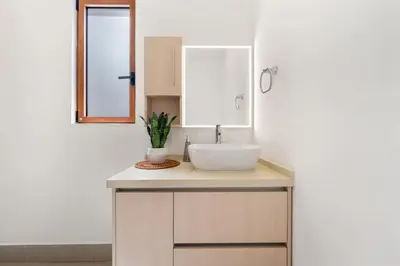 a bathroom with a sink and a mirror at Panaromic Oceanview Luxury 3BR Private Rooftop in Tamarindo