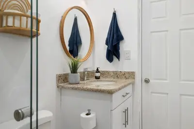 a bathroom with a sink and a mirror at Peaceful 2BR Retreat w Pool - Near CR Best Beaches in Matapalo