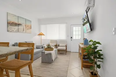 a living room with a couch and a table at Peaceful 2BR Retreat w Pool - Near CR Best Beaches in Matapalo