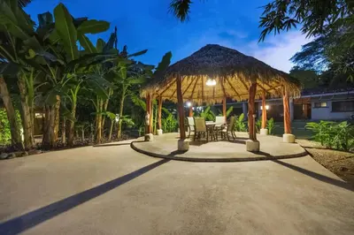 a gazebo with a table and chairs under it at Peaceful 2BR Retreat w Pool - Near CR Best Beaches in Matapalo