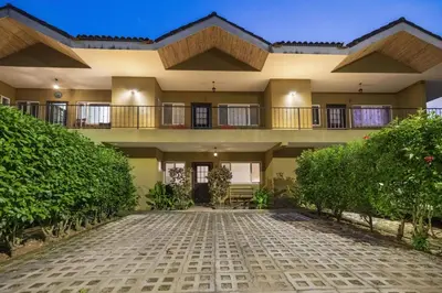 a large building with a balcony and a courtyard at Peaceful 2BR Retreat w Pool - Near CR Best Beaches in Matapalo