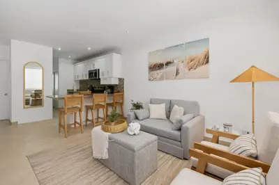 a living room with a couch and a kitchen at Peaceful 2BR Retreat w Pool - Near CR Best Beaches in Matapalo