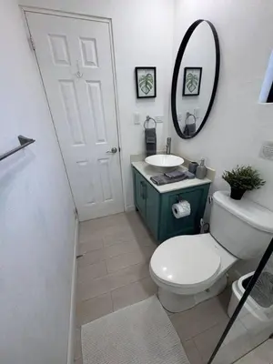 a bathroom with a toilet and a sink and a mirror at Peaceful 1BR Casita with Private Deck Near Tamarindo in Tamarindo