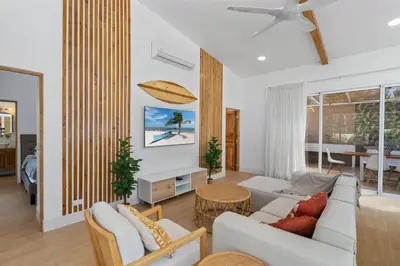 a living room with a couch and a table at Peaceful Jungle Escape with Private Pool in Playa Grande