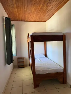 a bedroom with two bunk beds in a room at La Buena Vida in Nicoya