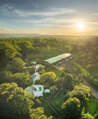 an aerial view of a park with a river and trees at Hotel Hot Springs Sueno Dorado in Fortuna