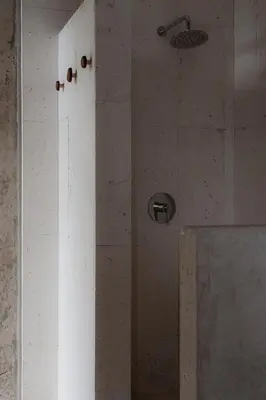 a shower with a glass door in a bathroom at The Town at Praia in Jacó
