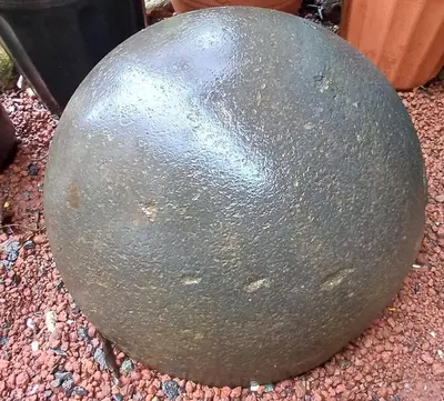 a large gray ball sitting on the ground at Casa Monstera Monteverde in Cebadilla