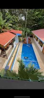 a large blue swimming pool in a resort at Tres Diamantes Casa Completa in Parrita