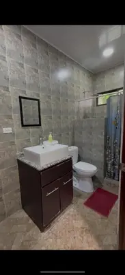 a bathroom with a sink and a toilet at Tres Diamantes Casa Completa in Parrita
