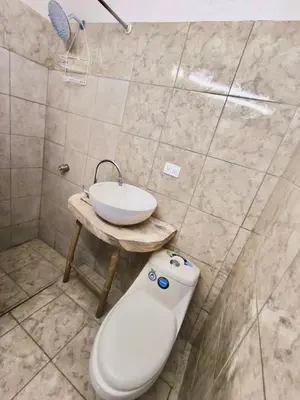a bathroom with a white toilet and a sink at Flamingo 107 Cabins apartment, 100mts from the beach in Playa Flamingo