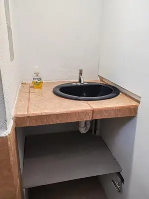 a bathroom vanity with a sink in a room at Bonito apartamento 103 frente a la piscina 100mt del mar in Playa Flamingo