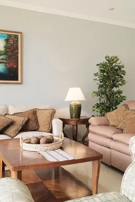 a living room with a couch and a table at Arenal, Completely Yours Ultra Private Estate in Fortuna