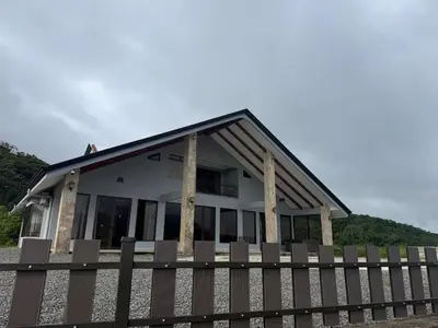 a house with a fence in front of it at Arenal, Completely Yours Ultra Private Estate in Fortuna