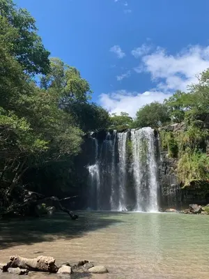 a waterfall in the middle of a body of water at Casa Motmot en Liberia in Liberia