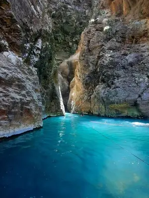 a pool of blue water in a canyon at Casa Motmot en Liberia in Liberia