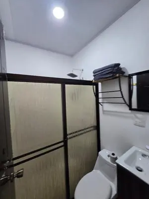 a bathroom with a shower and a toilet and a sink at Casa Motmot en Liberia in Liberia