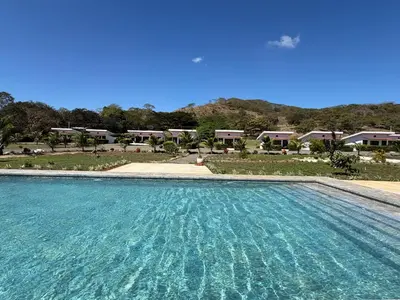 a large swimming pool in front of a resort at Hacienda Santa Elena in Santa Cruz