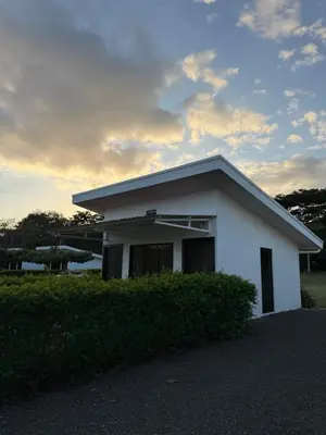 a small white house with a sky at Hacienda Santa Elena in Santa Cruz