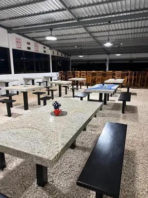 a group of picnic tables in a building at Hacienda Santa Elena in Santa Cruz