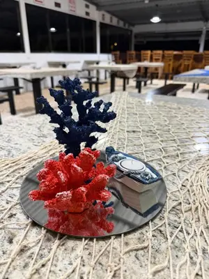 a plate with red and blue decorations on a table at Hacienda Santa Elena in Santa Cruz