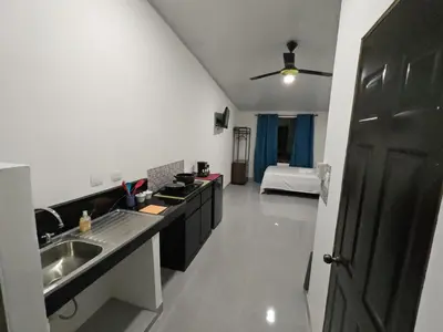 a kitchen with a sink and a counter top at Apartamento en la naturaleza a 35 min de la playa in Santa Cruz