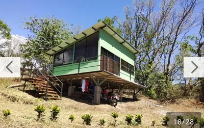 a small green house on top of a hill at Cielo Azul in Monteverde Costa Rica