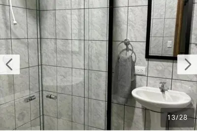 a bathroom with a shower and a sink and a mirror at Cielo Azul in Monteverde Costa Rica