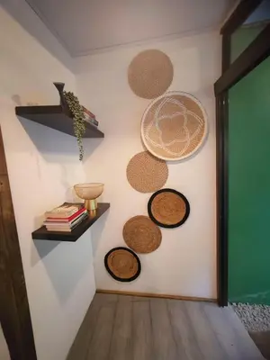 a room with several plates on the wall at Cozy Café Studio in El Copey