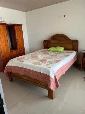 a bedroom with a bed with a quilt on it at Vacation Home in Santa Cruz in Santa Cruz
