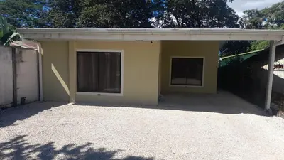 a small yellow house with two windows on it at Vacation Home in Santa Cruz in Santa Cruz