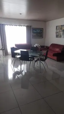 a living room with a table and chairs and a couch at Vacation Home in Santa Cruz in Santa Cruz