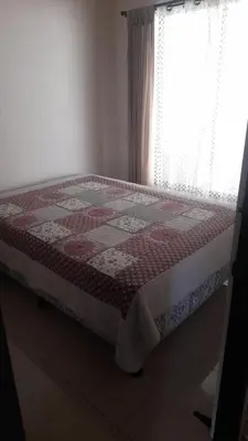 a bed with a quilt on it in a bedroom at Vacation Home in Santa Cruz in Santa Cruz