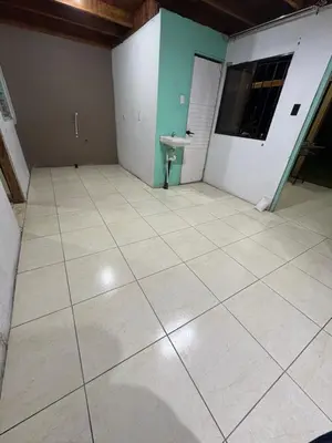an empty room with a tile floor and a sink at Quinta Don Ebal in Guácimo