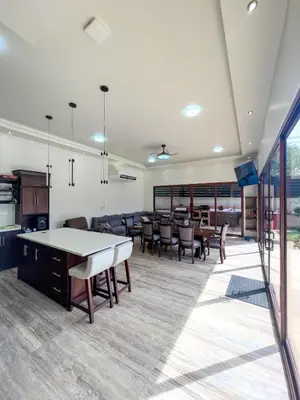 an open living room with a ping pong table at Casa Pura Vida in Coco
