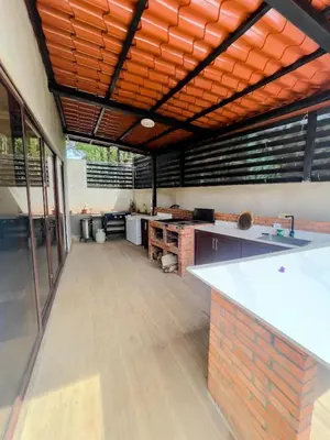 a large room with a kitchen with a counter top at Casa Pura Vida in Coco