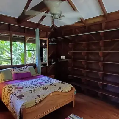 Wooden Cabin with deck Over Creek